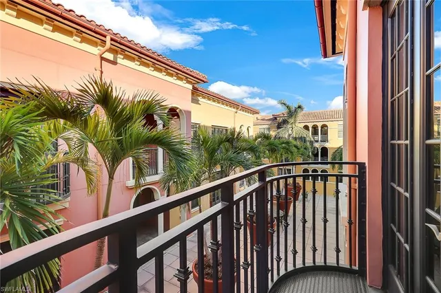 a view of balcony with a small yard