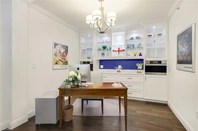 a view of kitchen with cabinets and wooden floor