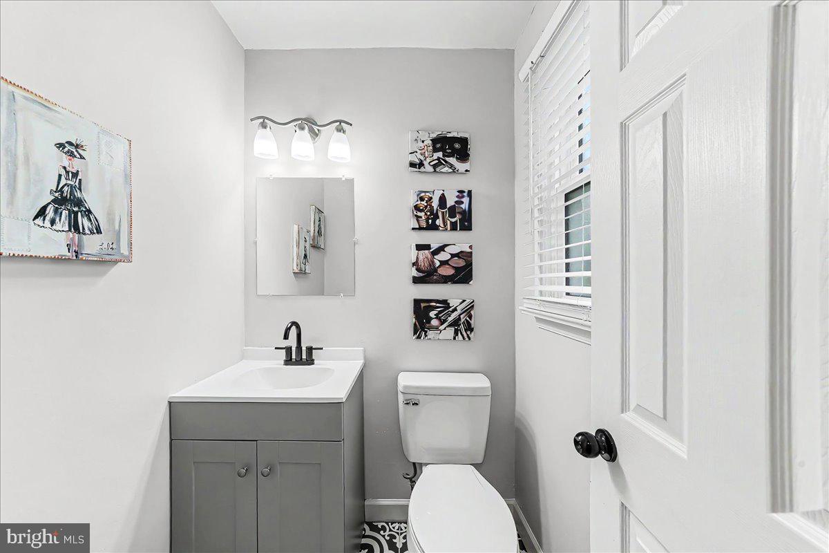 772 Hunters Run Road Pottstown, PA 19465 - Photo 23 of 44 a bathroom with a toilet sink and mirror
