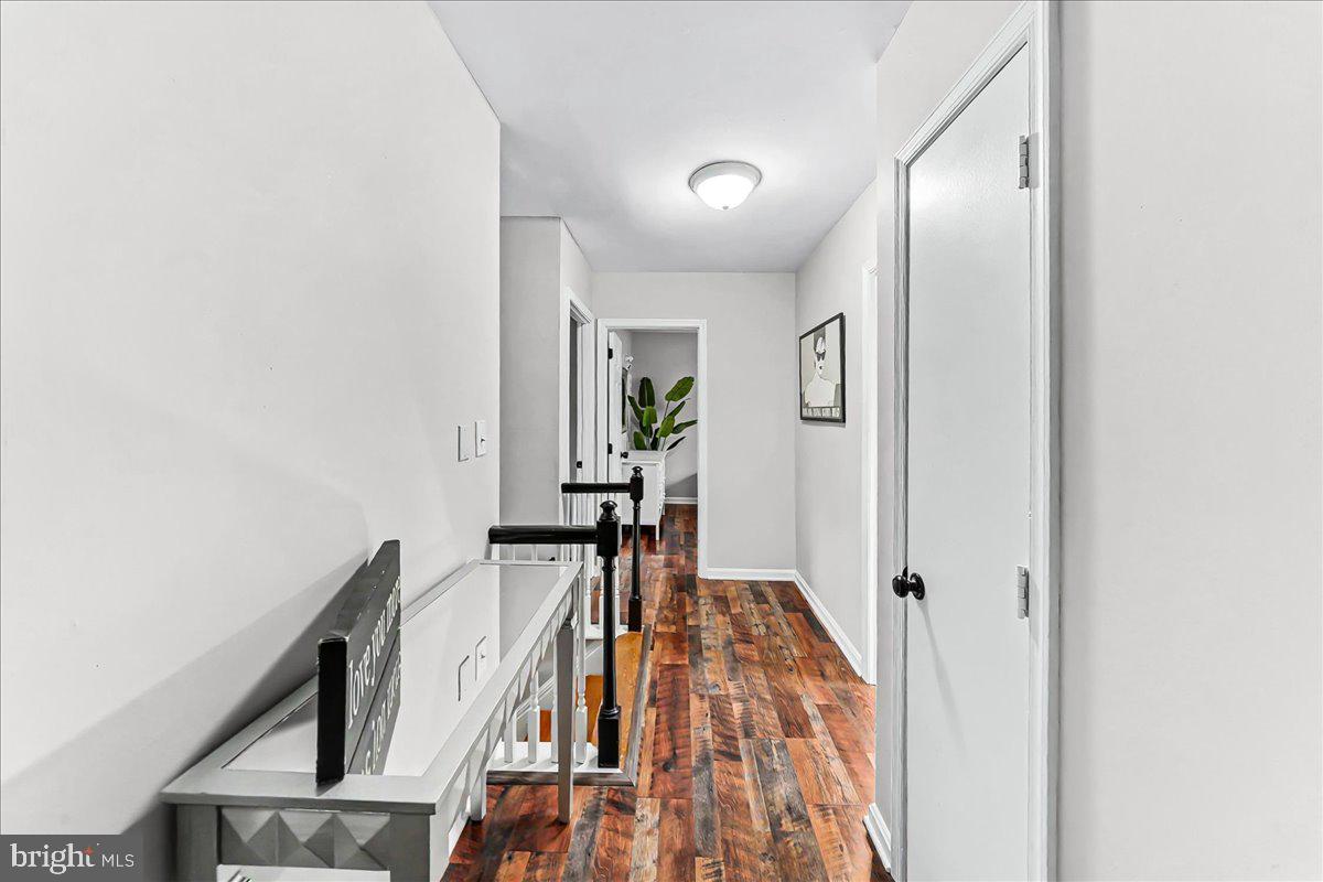 772 Hunters Run Road Pottstown, PA 19465 - Photo 24 of 44 a view of a hallway with furniture and wooden floor