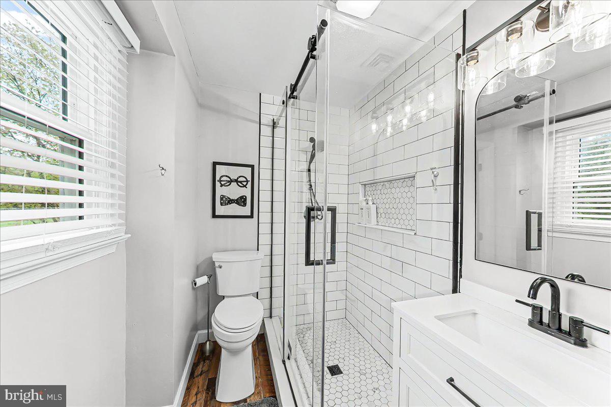 772 Hunters Run Road Pottstown, PA 19465 - Photo 28 of 44 a bathroom with a toilet sink vanity granite and shower