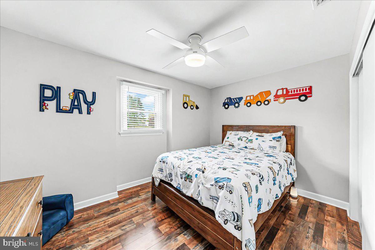 772 Hunters Run Road Pottstown, PA 19465 - Photo 35 of 44 a bedroom with a bed and a chandelier