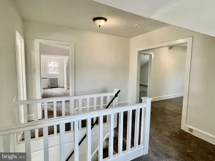 a view of a hallway with windows