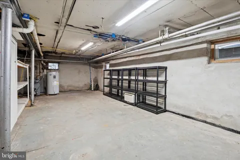 a view of a deck with furniture and barbeque oven