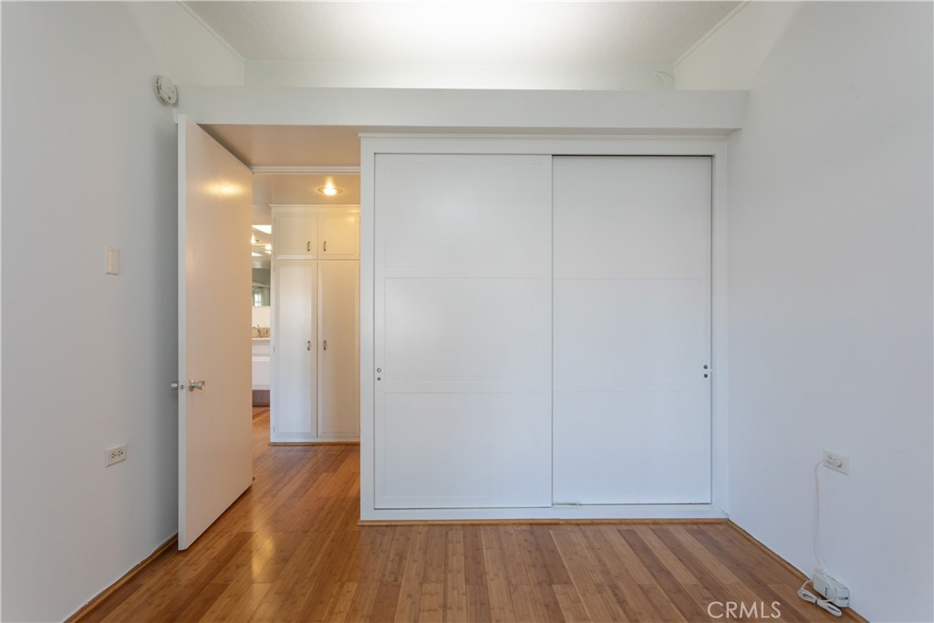 1180 Oakmont Road, Unit 51H Seal Beach, CA 90740 - Photo 30 of 31 a view of room with wooden floor