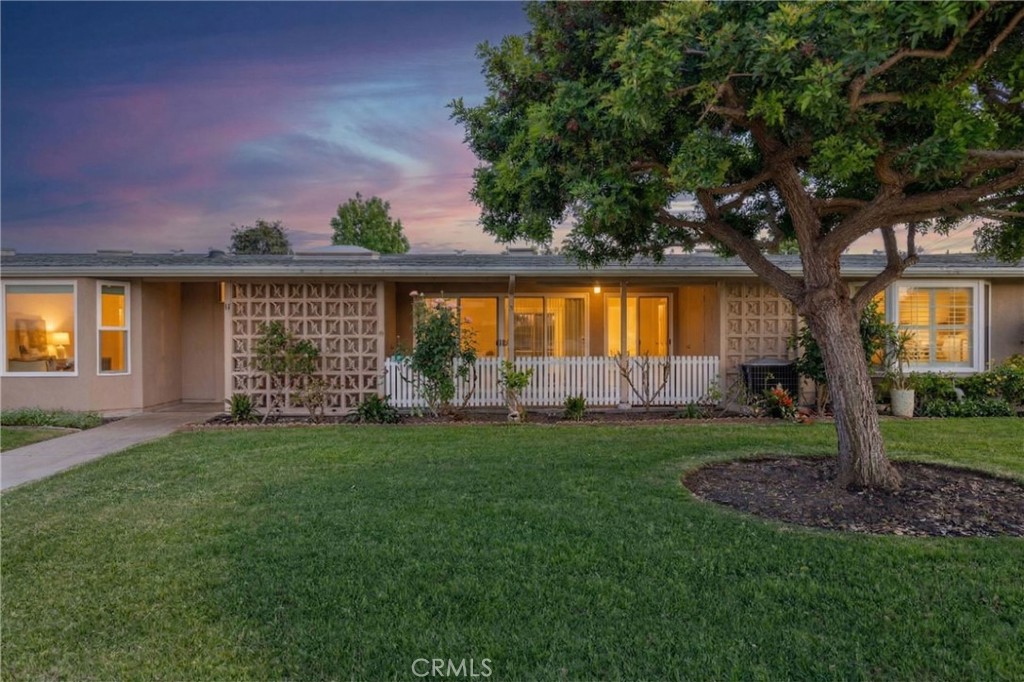 1180 Oakmont Road, Unit 51H Seal Beach, CA 90740 - Photo 31 of 31 a view of a house with a yard and sitting area