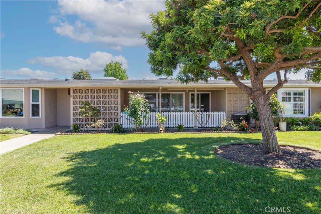 1180 Oakmont Road, Unit 51H Seal Beach, CA 90740 - Photo 4 of 31 a view of a house with a yard