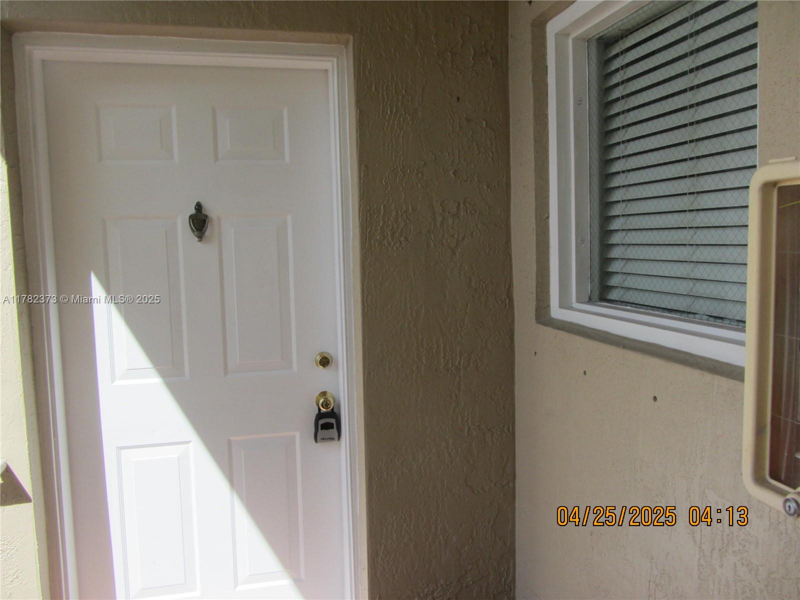 Villa Encantada Miami, FL 33177 - Photo 13 of 35 a view of a hallway with a door