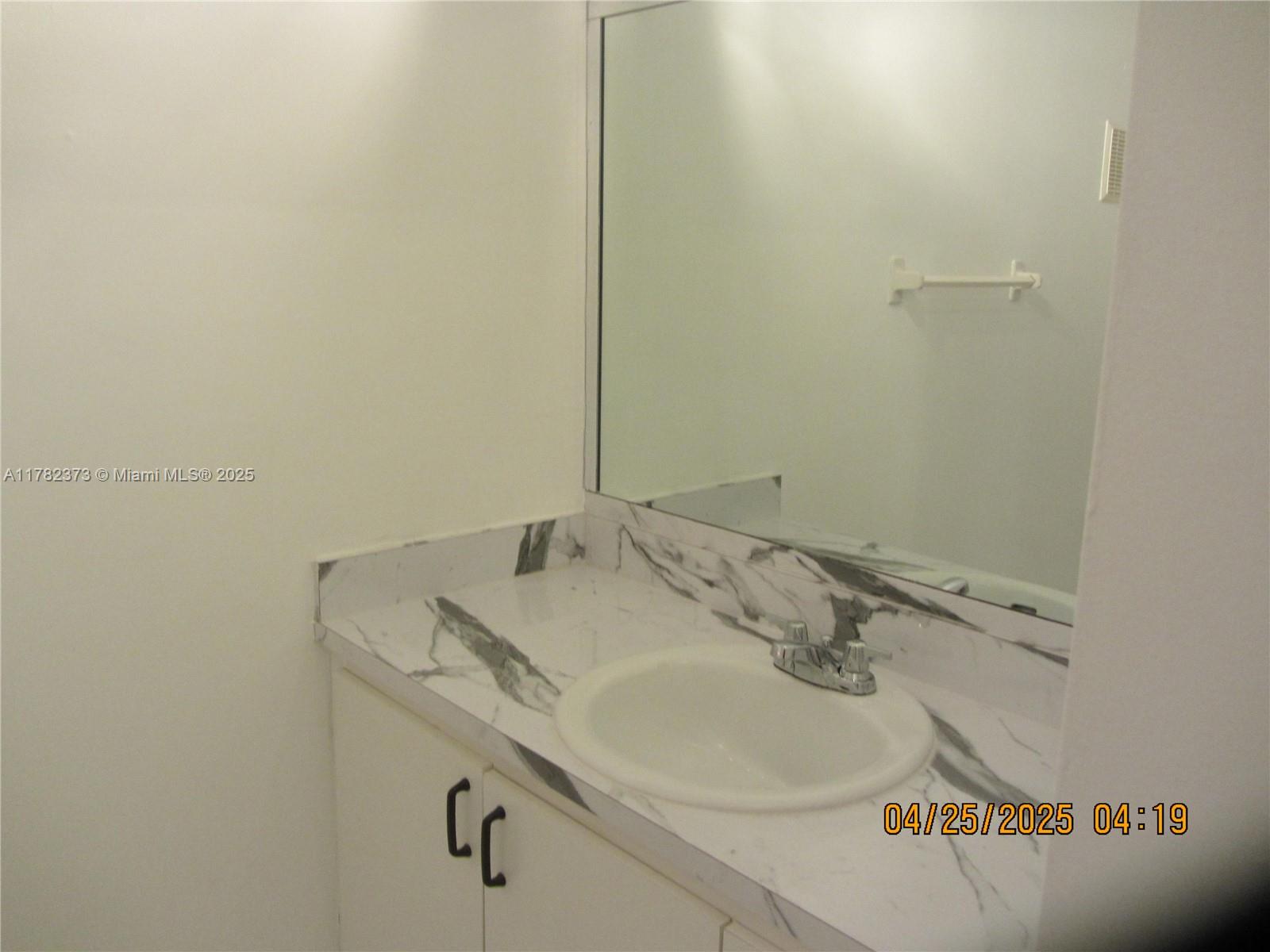 Villa Encantada Miami, FL 33177 - Photo 29 of 35 a bathroom with a sink and vanity