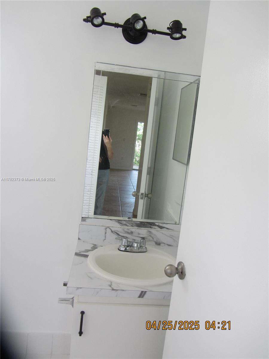 Villa Encantada Miami, FL 33177 - Photo 34 of 35 a bathroom with a sink and a mirror