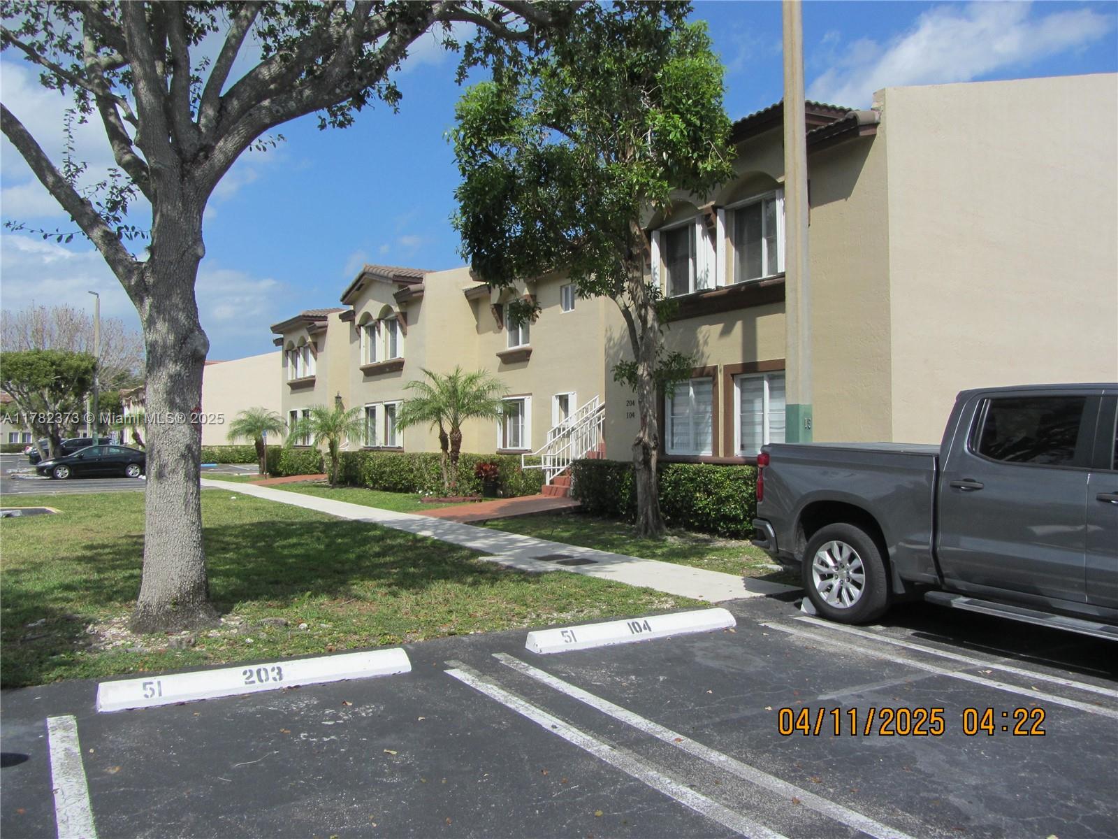 Villa Encantada Miami, FL 33177 - Photo 6 of 35 a front view of a house with garden