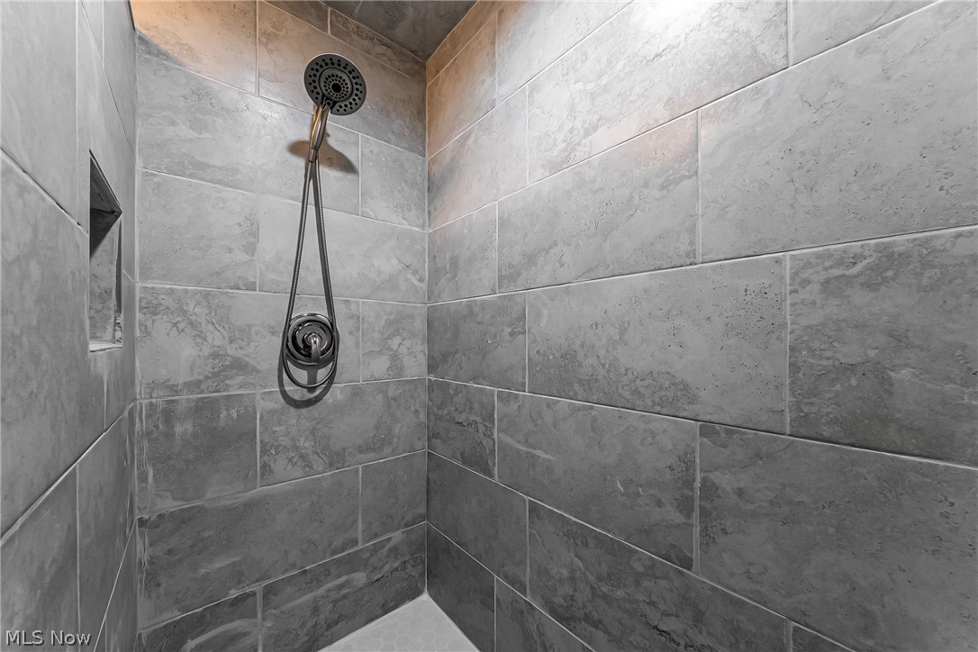 13800 Fairhill Road, Unit 306 Cleveland, OH 44120 - Photo 15 of 48 Bathroom view of a tile shower