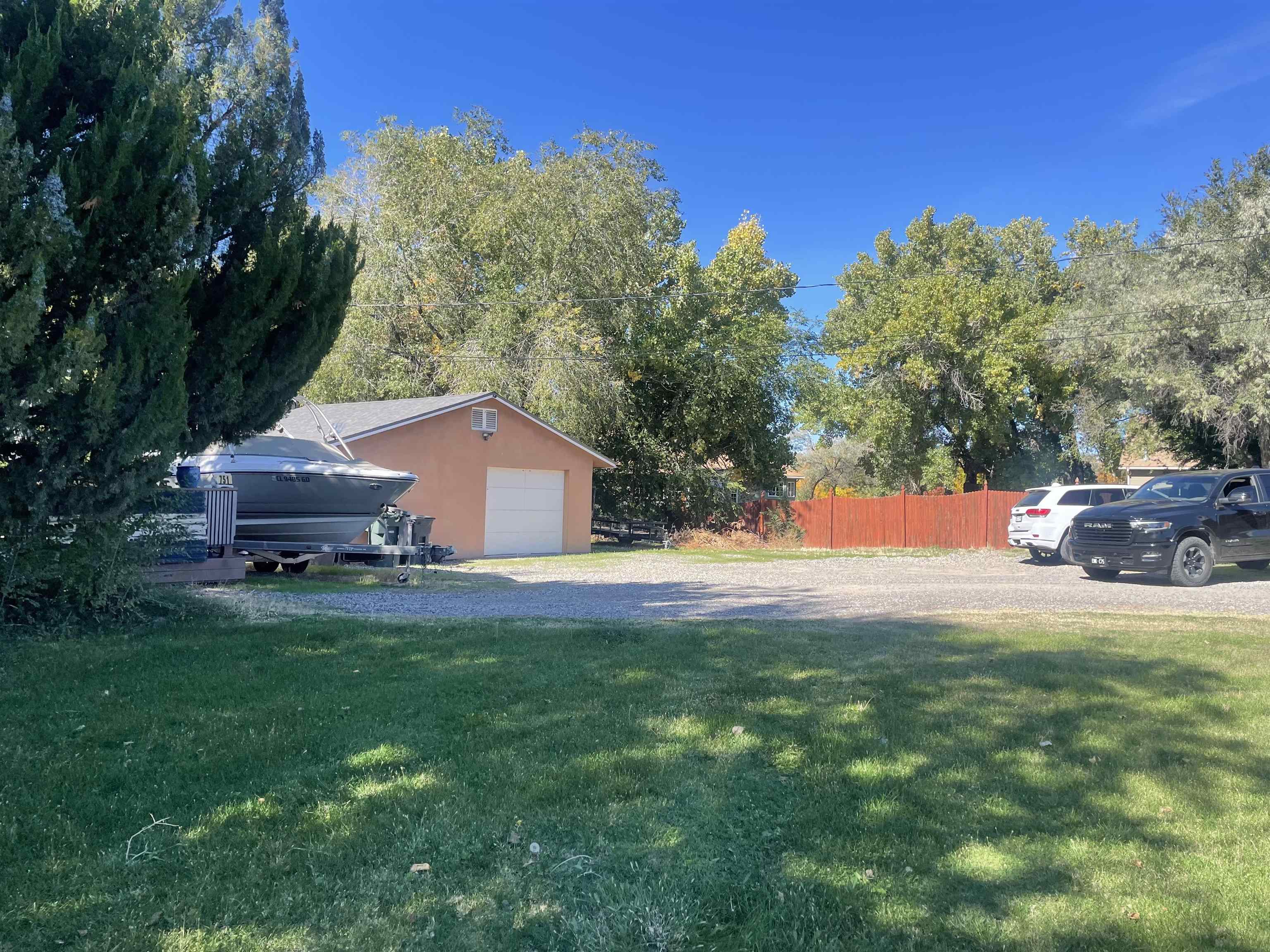 751-26 26 1/2 Road Grand Junction, CO 81506 - Photo 5 of 10 a backyard of a house with table and chairs