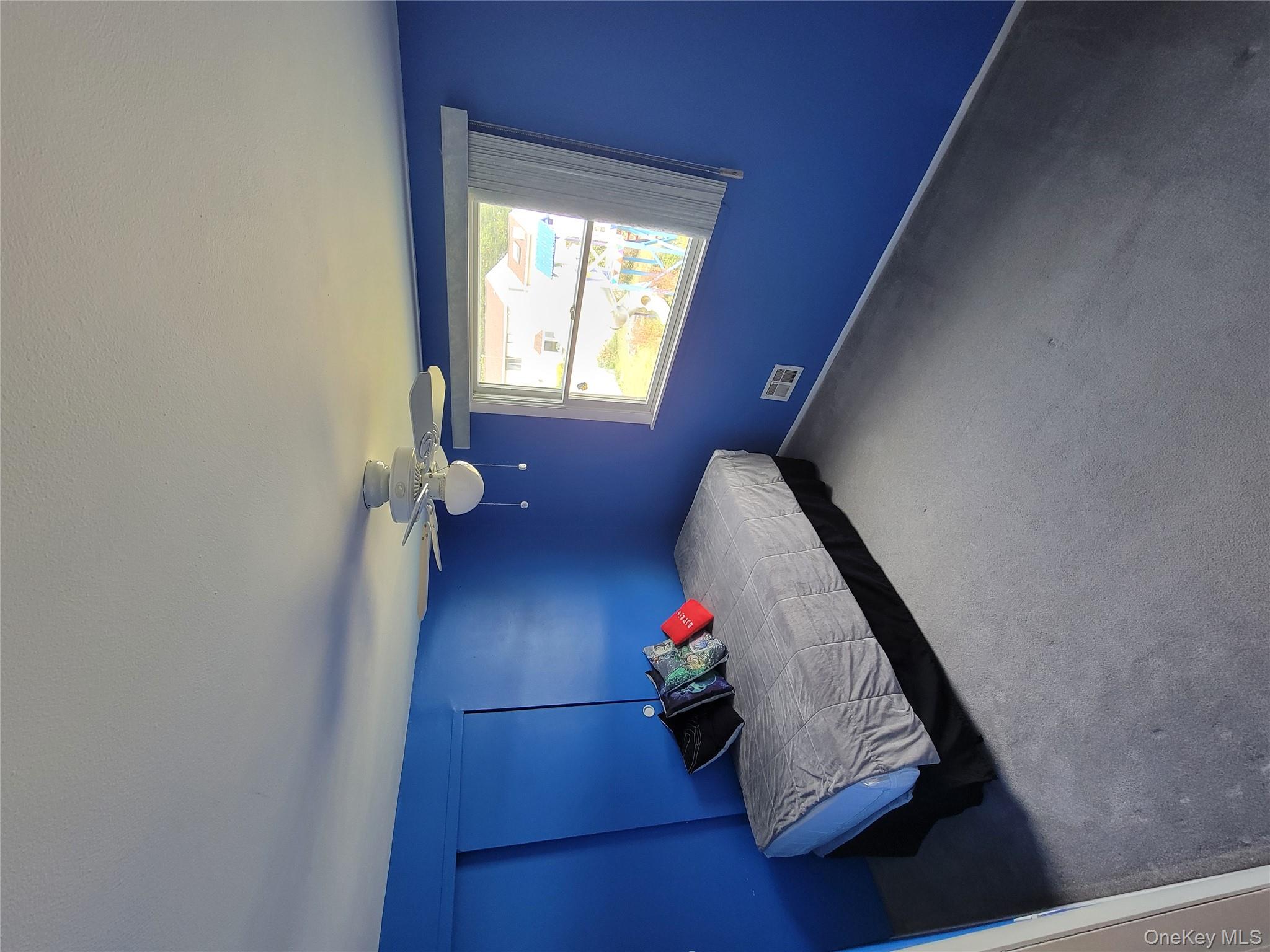 7 Deville Drive Selden, NY 11784 - Photo 16 of 19 a bedroom with a bed and window