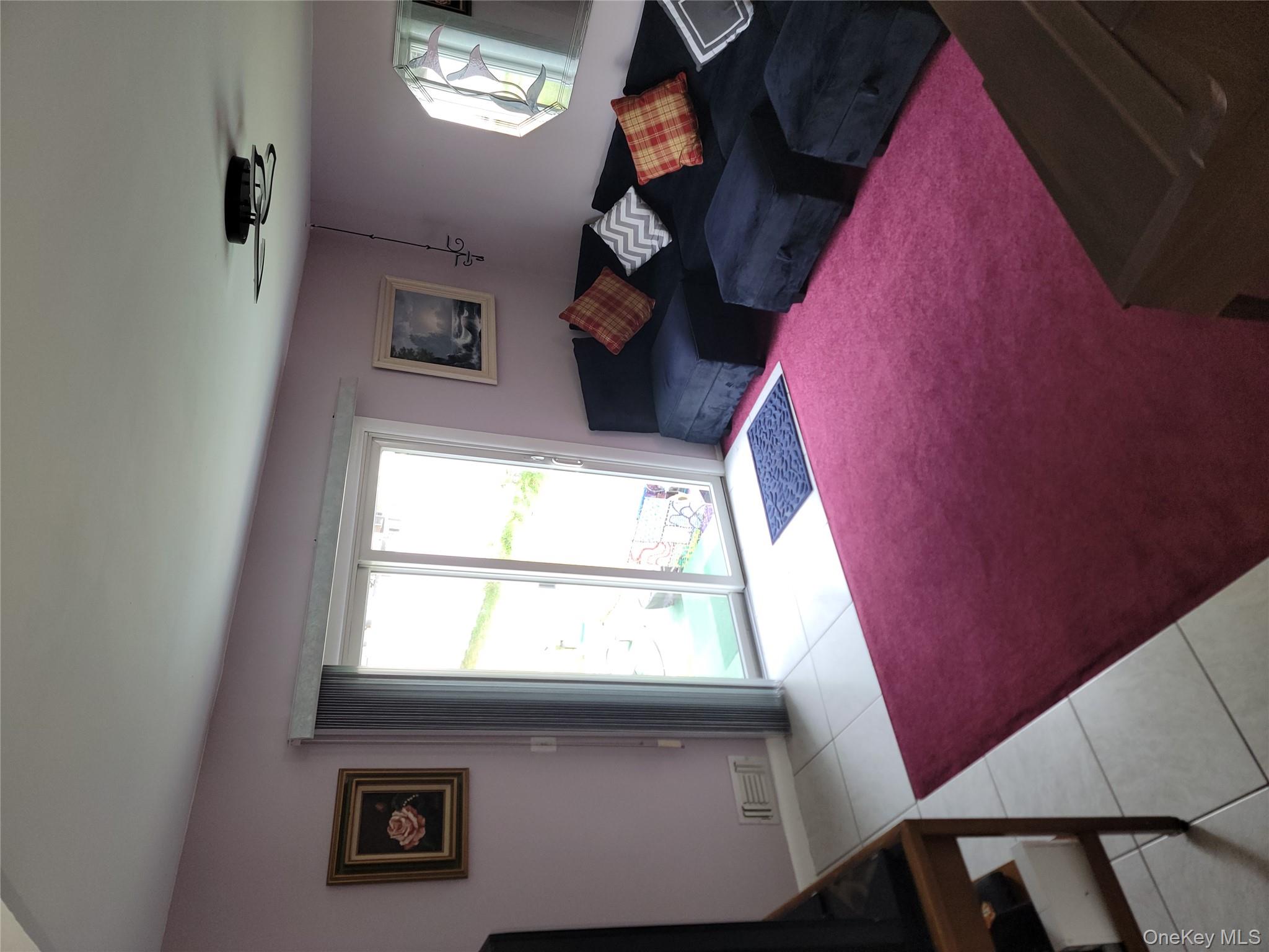 7 Deville Drive Selden, NY 11784 - Photo 6 of 19 a bedroom with a bed and a window