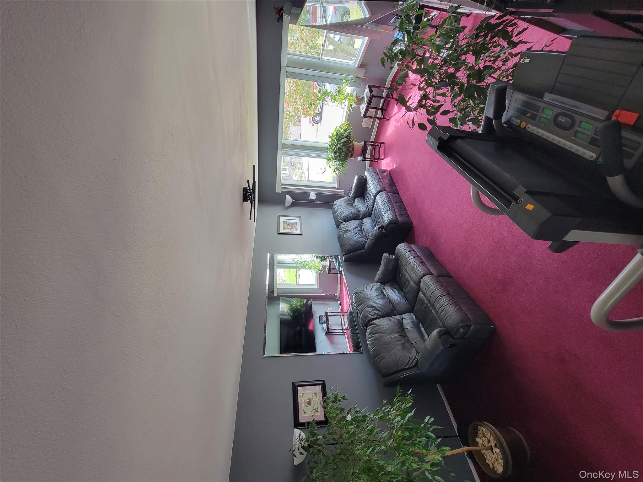 7 Deville Drive Selden, NY 11784 - Photo 7 of 19 a living room with furniture rug and a large window