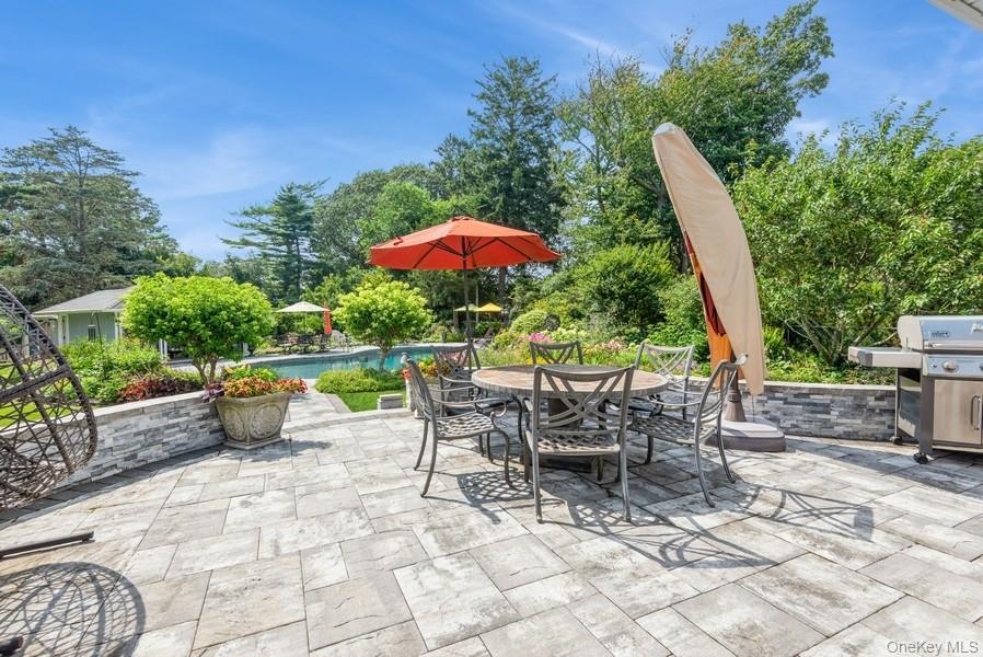 330 Private Road East Patchogue, NY 11772 - Photo 11 of 42 an outdoor space with furniture and umbrella