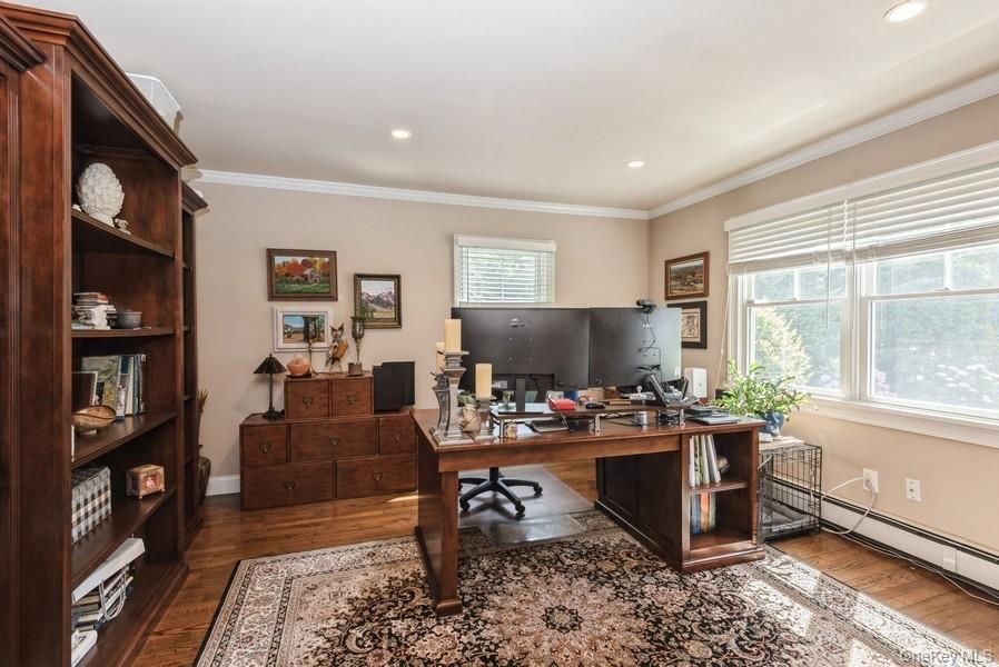 330 Private Road East Patchogue, NY 11772 - Photo 15 of 42 a living room with furniture and a flat screen tv