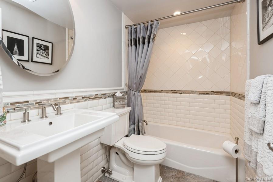 330 Private Road East Patchogue, NY 11772 - Photo 17 of 42 a bathroom with a sink toilet and shower