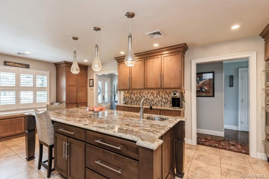 330 Private Road East Patchogue, NY 11772 - Photo 19 of 42 a bathroom with a granite countertop sink and a large mirror