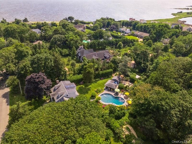 330 Private Road East Patchogue, NY 11772 - Photo 2 of 42 an aerial view of a house with a yard