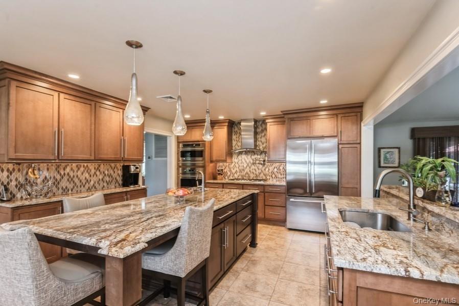 330 Private Road East Patchogue, NY 11772 - Photo 21 of 42 a kitchen with granite countertop lots of counter top space and refrigerator