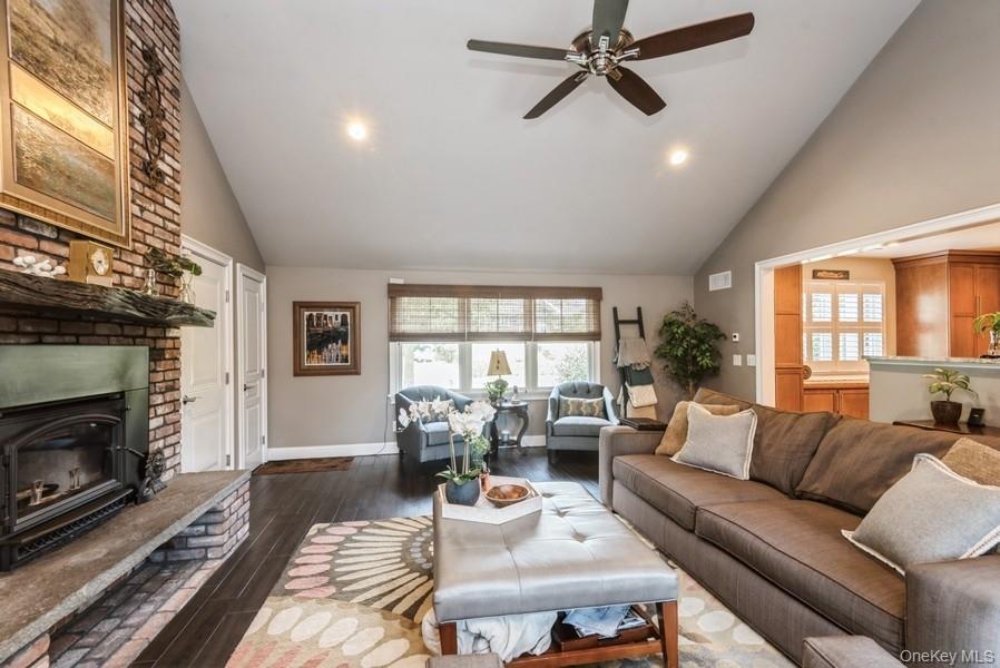 330 Private Road East Patchogue, NY 11772 - Photo 27 of 42 a living room with furniture and a fireplace