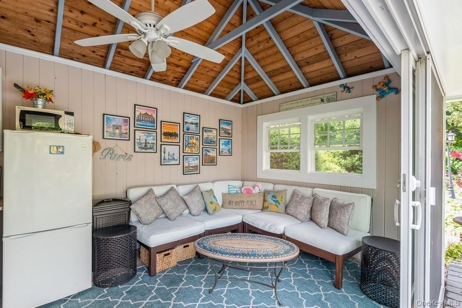 330 Private Road East Patchogue, NY 11772 - Photo 7 of 42 a living room with furniture and a large window