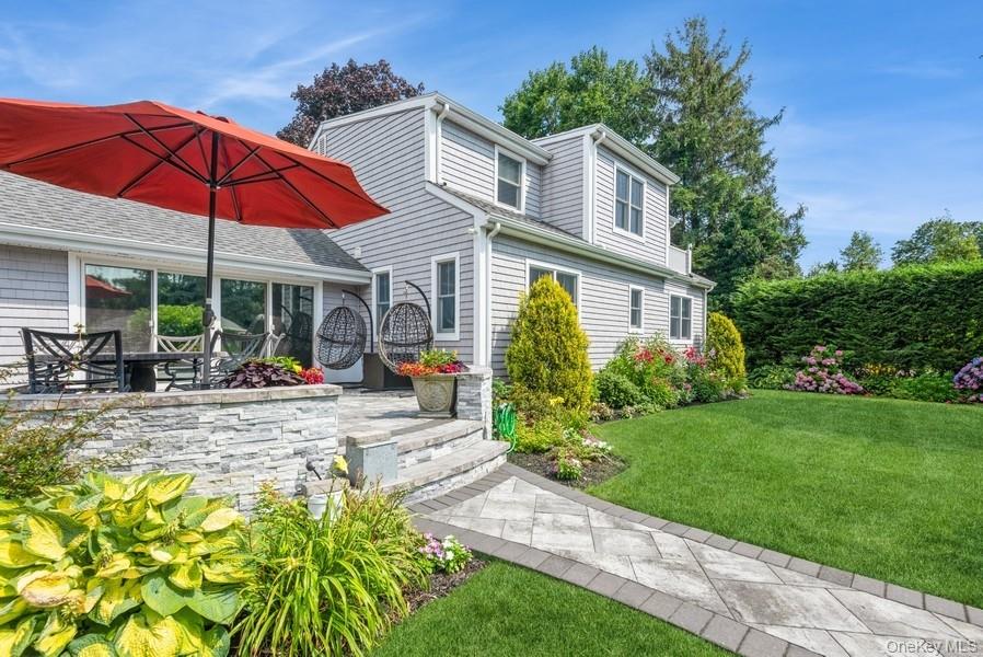330 Private Road East Patchogue, NY 11772 - Photo 9 of 42 a view of a house with backyard sitting area and garden