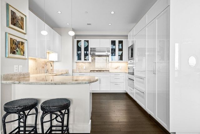 a bedroom with a bed and large window