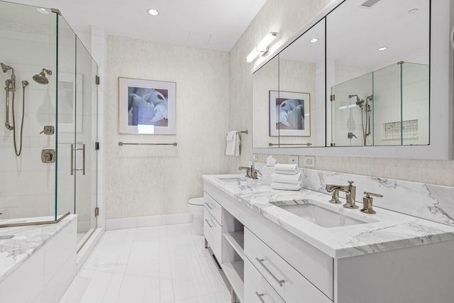 a spacious bathroom with a bathtub and a shower