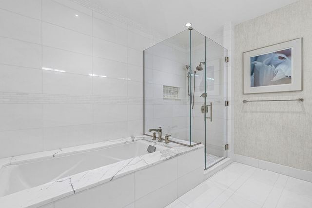 a en suite bathroom with a sink and mirror