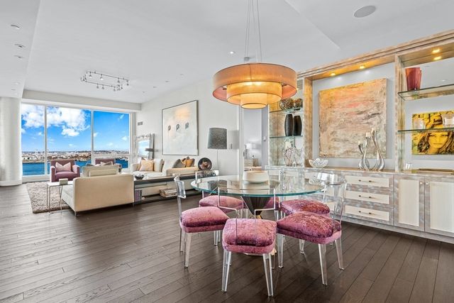an open kitchen with dining table and chairs