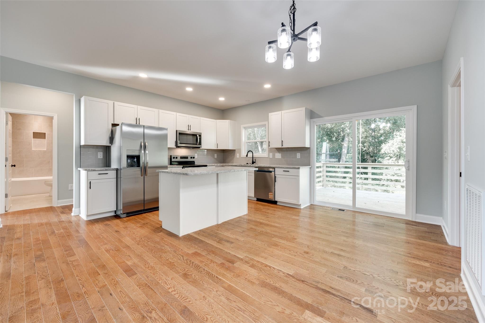 171 William Street York, SC 29745 - Photo 11 of 28 a kitchen with white cabinets and stainless steel appliances