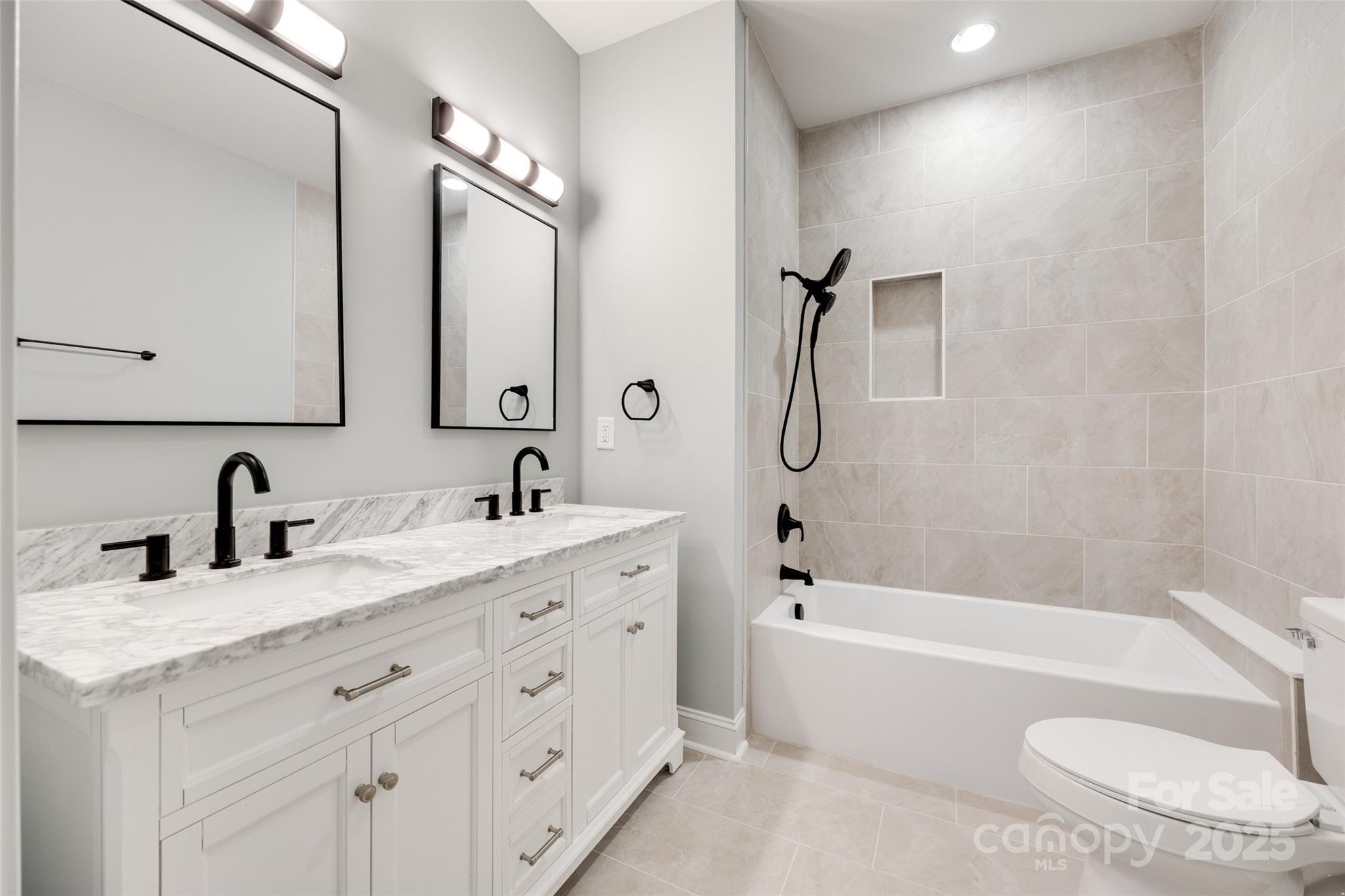 171 William Street York, SC 29745 - Photo 21 of 28 a bathroom with a granite countertop sink a toilet and bathtub