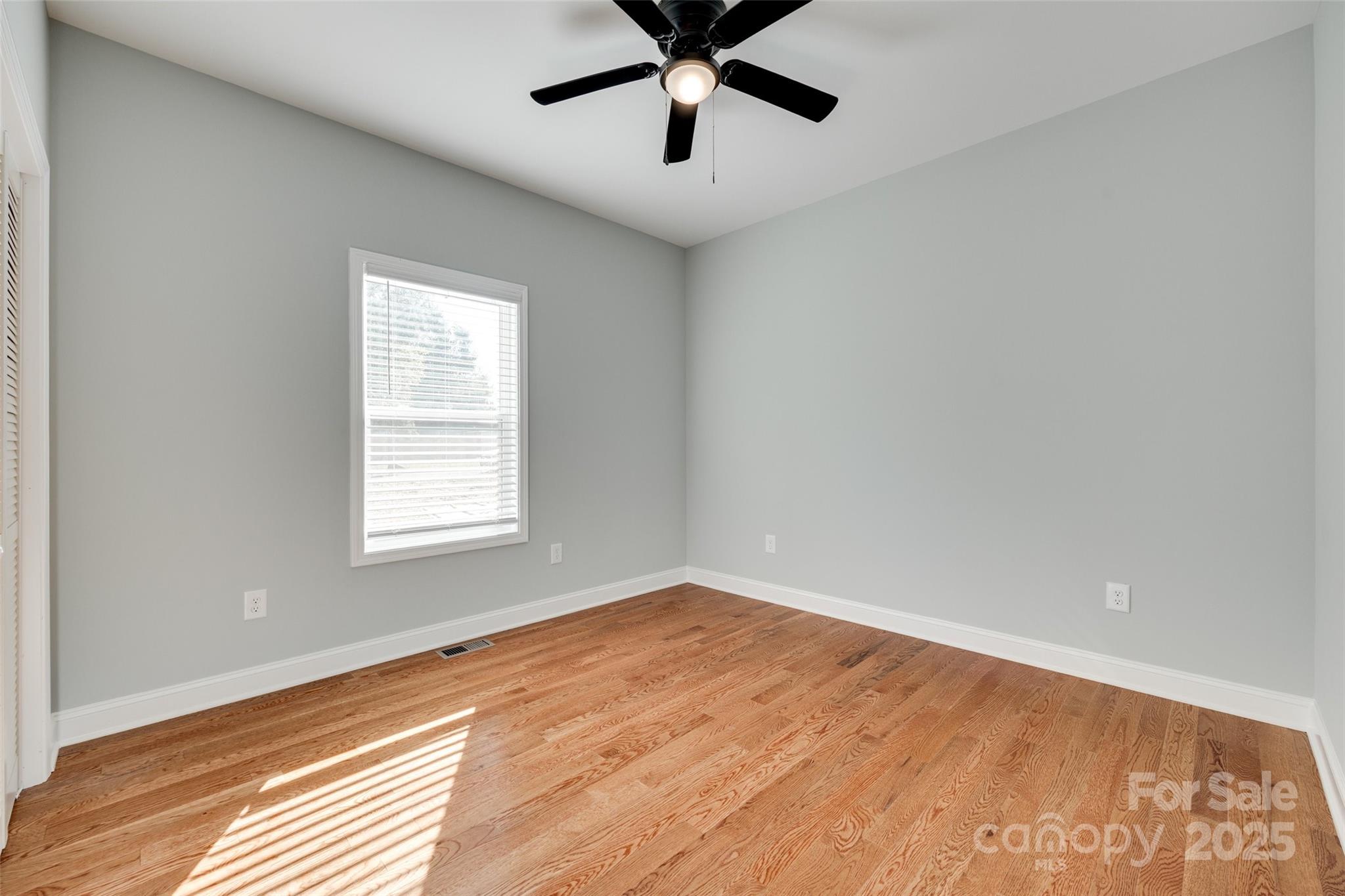 171 William Street York, SC 29745 - Photo 25 of 28 an empty room with a window and a fan