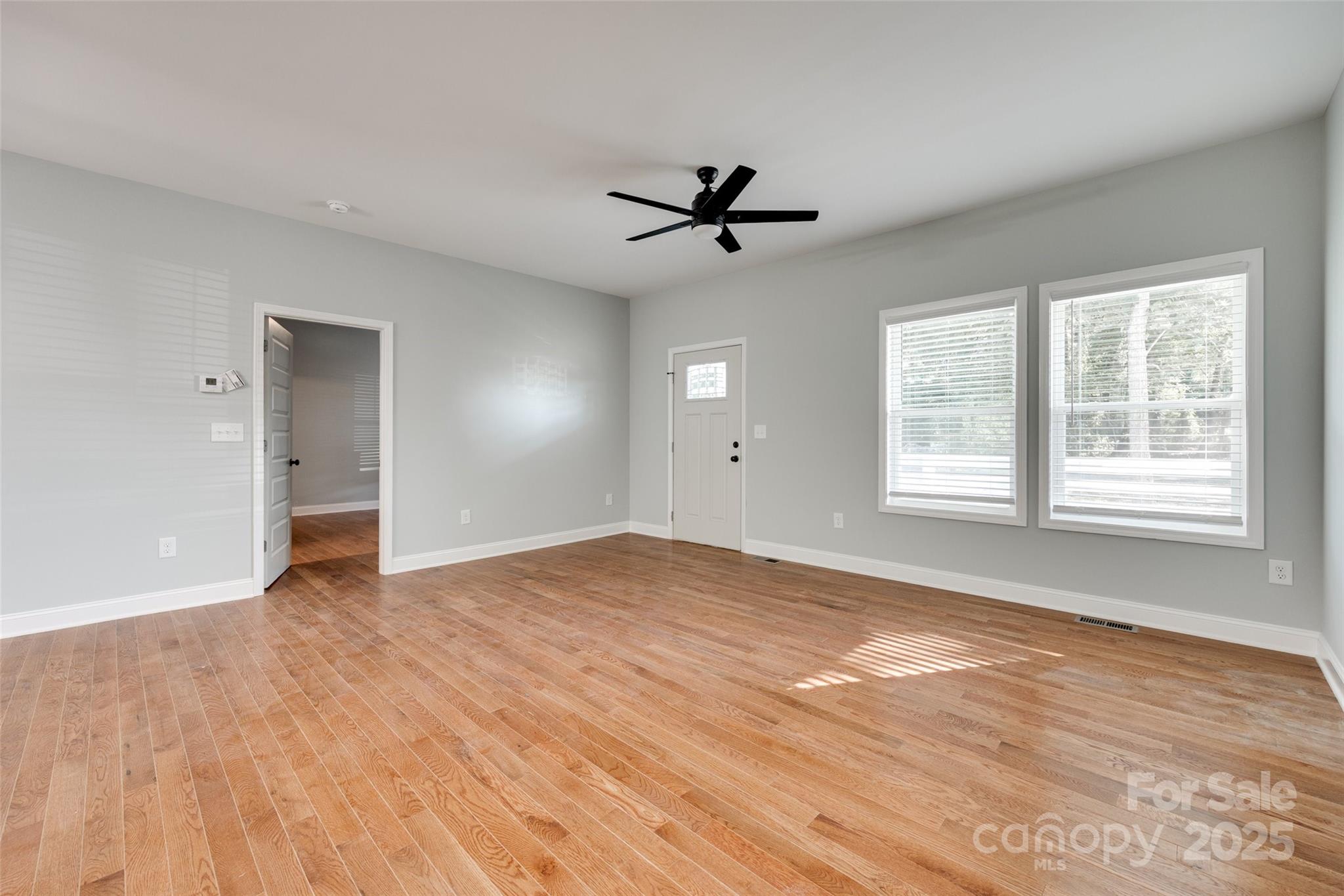 171 William Street York, SC 29745 - Photo 7 of 28 a view of empty room with wooden floor and fan