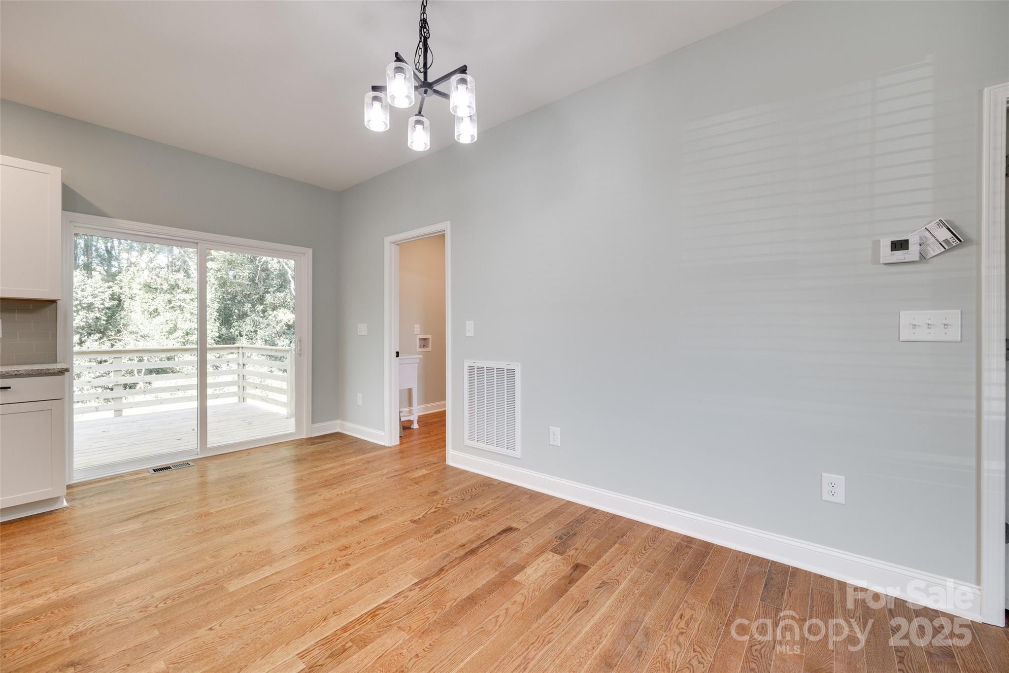 171 William Street York, SC 29745 - Photo 10 of 28 a view of an empty room with wooden floor and a window