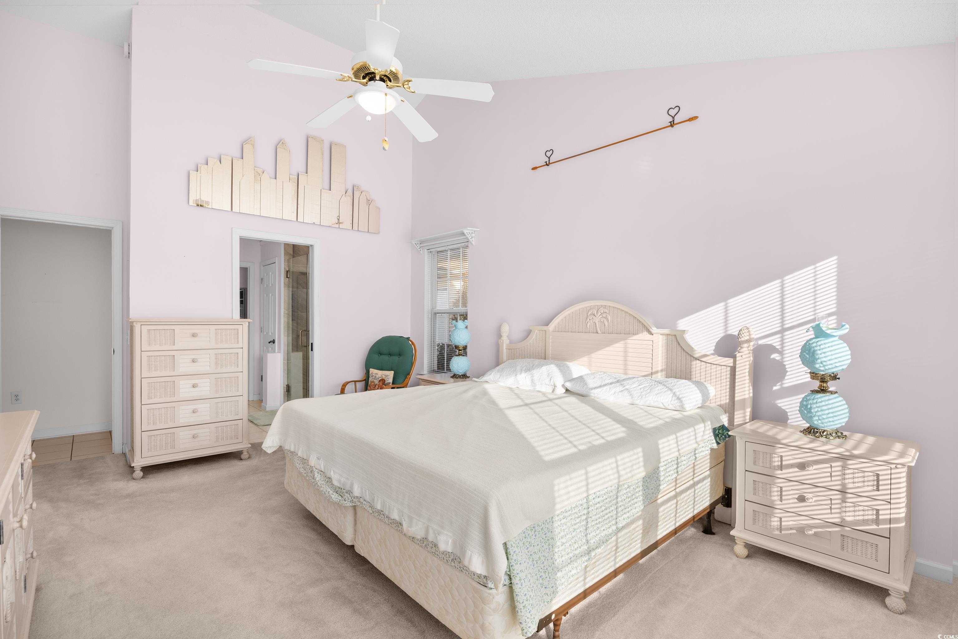 1744 Starbridge Drive Surfside Beach, SC 29575 - Photo 18 of 38 Bedroom featuring carpet, ceiling fan, ensuite bathroom, and high vaulted ceiling