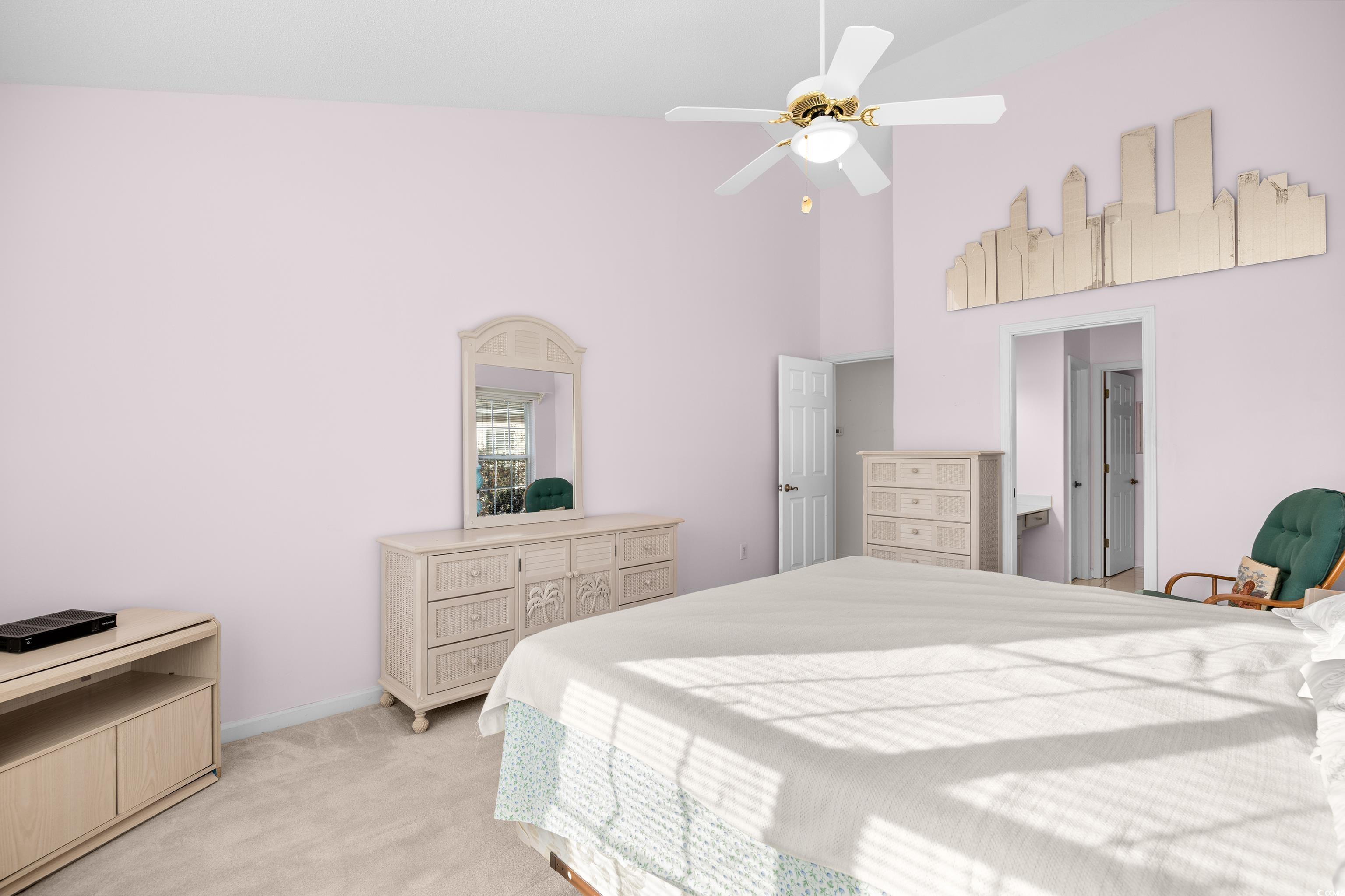 1744 Starbridge Drive Surfside Beach, SC 29575 - Photo 19 of 38 Bedroom featuring light carpet, ceiling fan, and a towering ceiling