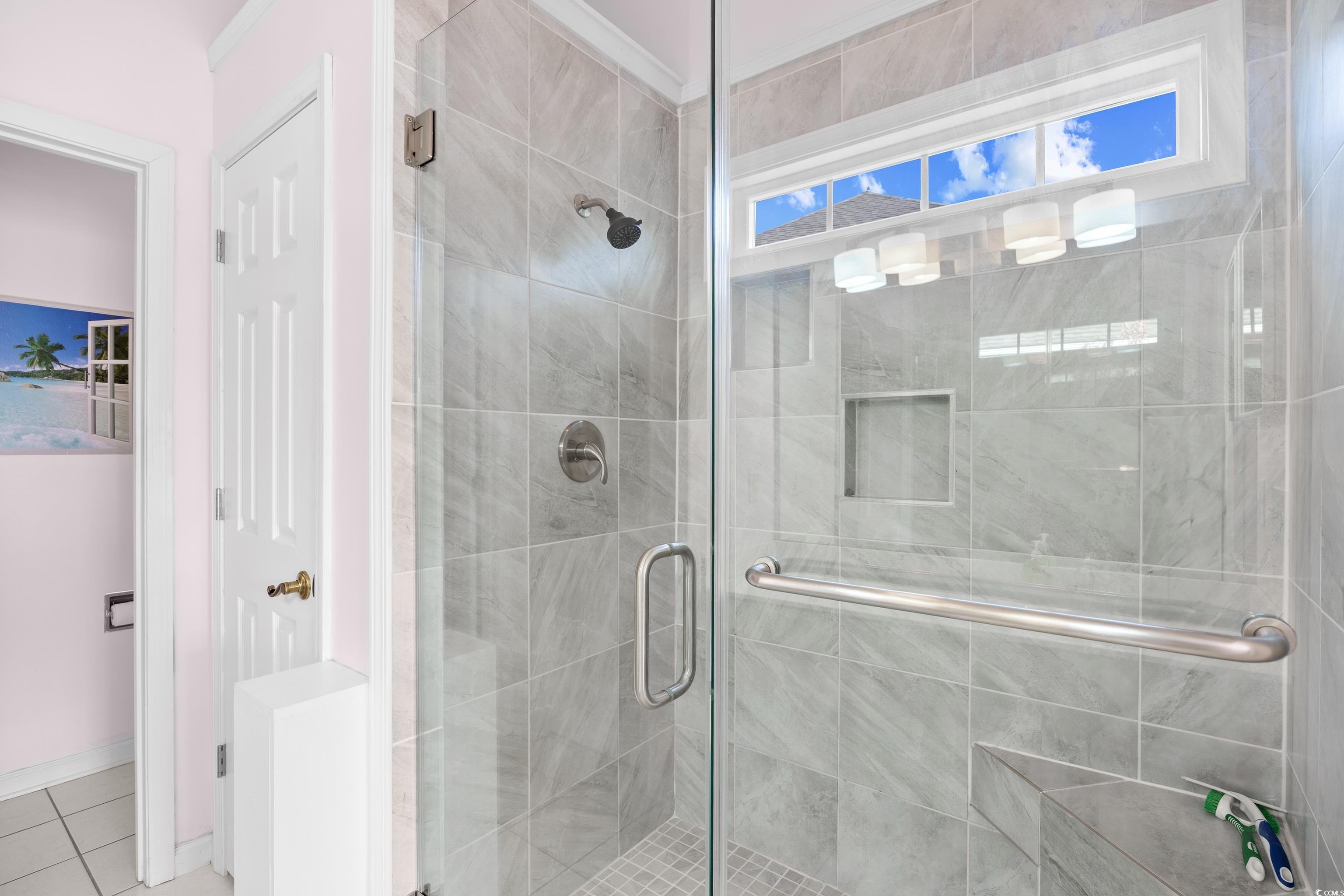 1744 Starbridge Drive Surfside Beach, SC 29575 - Photo 20 of 38 Bathroom with a stall shower and tile patterned flooring
