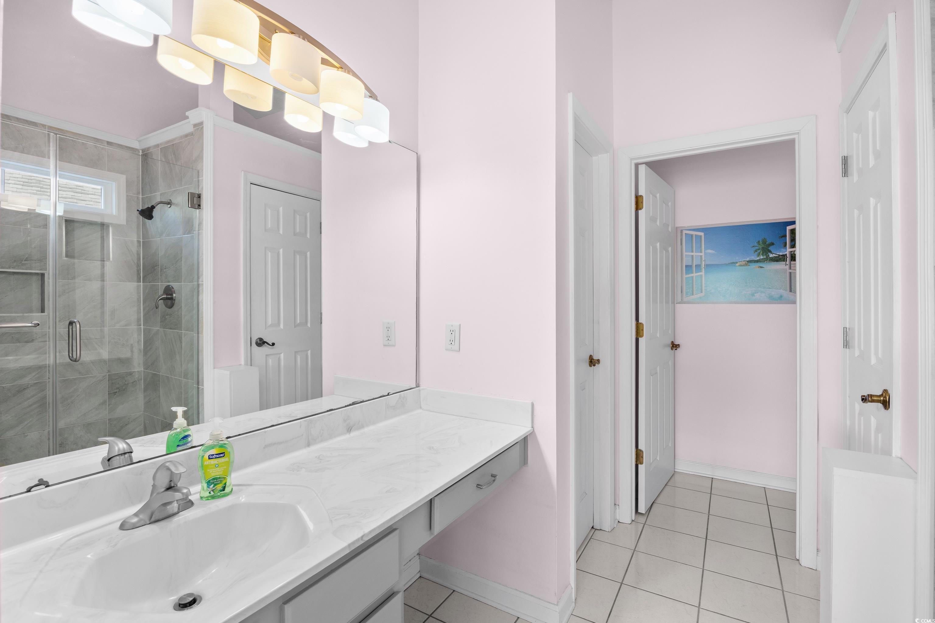1744 Starbridge Drive Surfside Beach, SC 29575 - Photo 21 of 38 Bathroom with vanity, light tile patterned flooring, and a stall shower