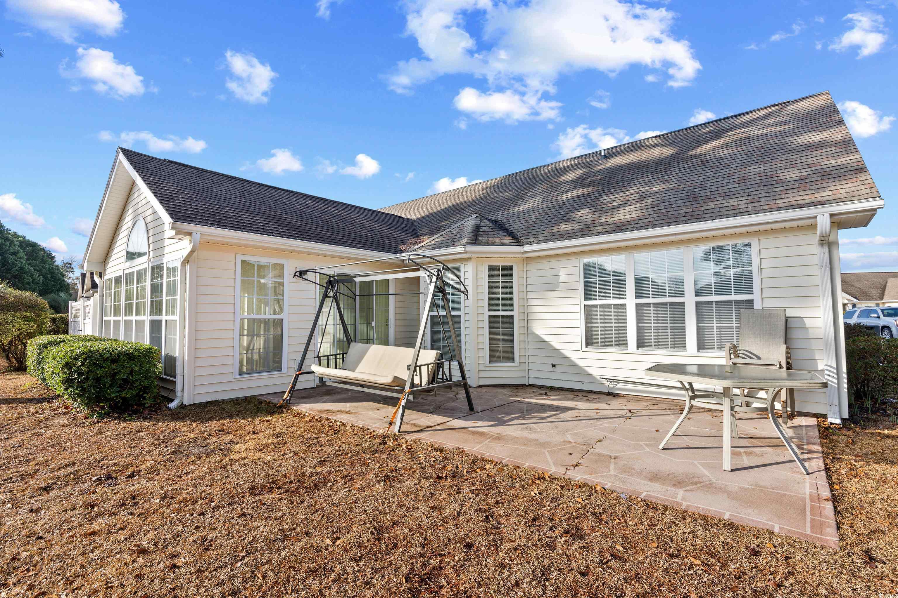 1744 Starbridge Drive Surfside Beach, SC 29575 - Photo 30 of 38 Rear view of property featuring a patio area and a shingled roof