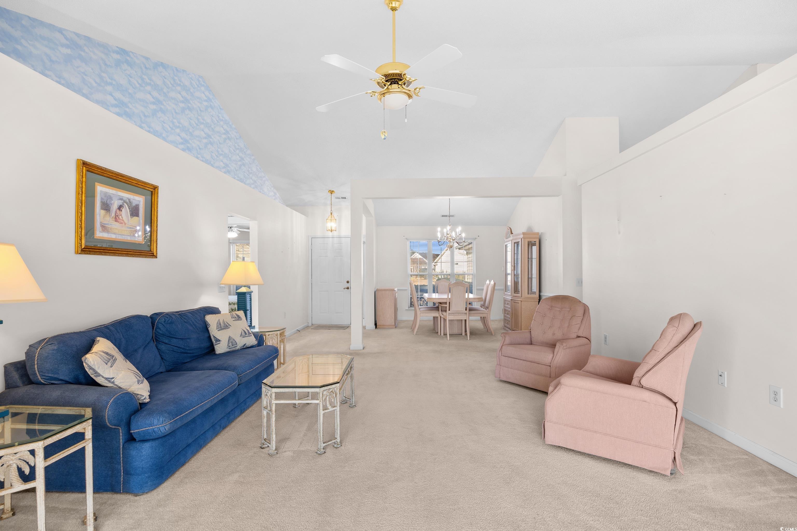 1744 Starbridge Drive Surfside Beach, SC 29575 - Photo 5 of 38 Living room with vaulted ceiling, carpet flooring, a ceiling fan, and a chandelier