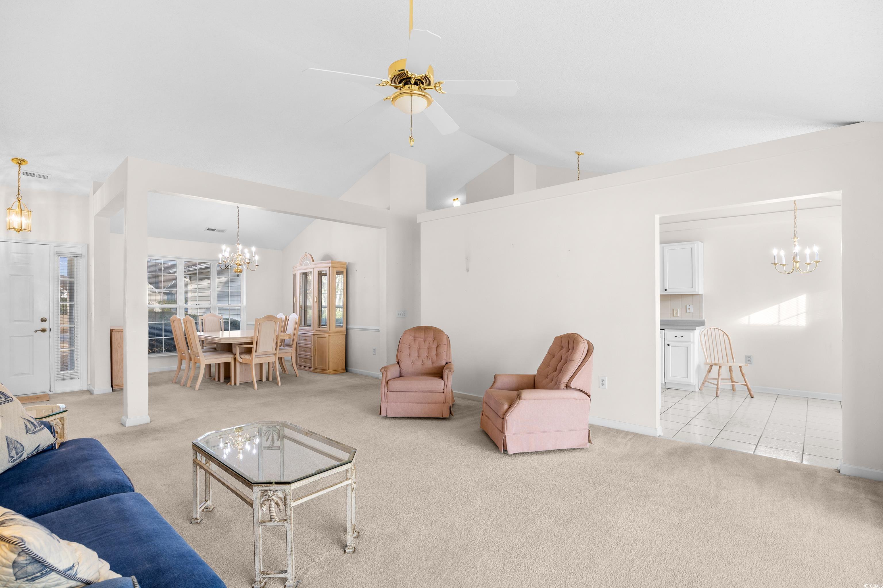 1744 Starbridge Drive Surfside Beach, SC 29575 - Photo 6 of 38 Carpeted living room with a chandelier, high vaulted ceiling, and ceiling fan