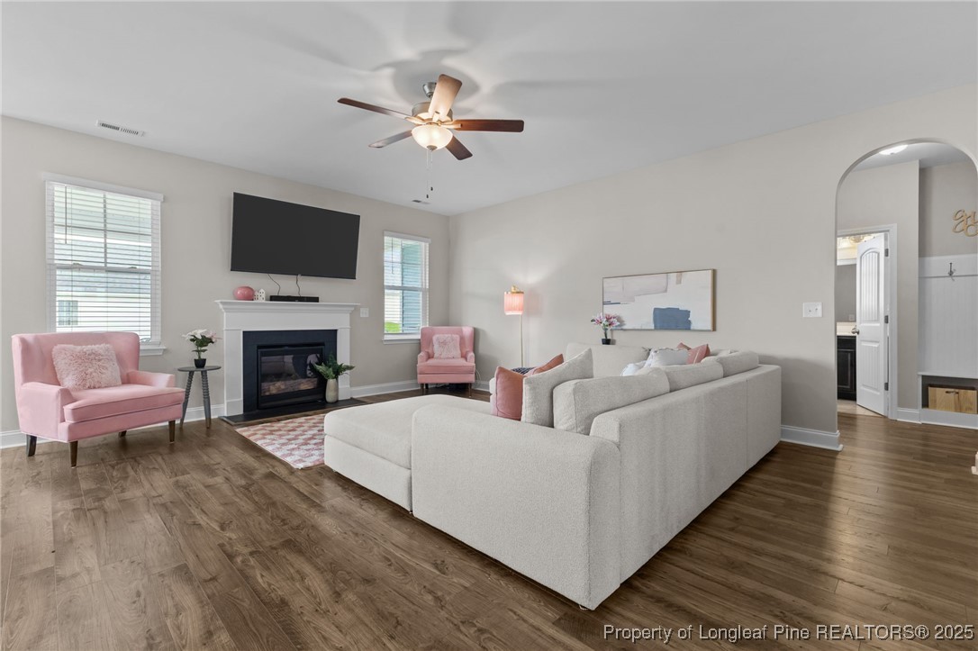 172 Haynes Church Road Raeford, NC 28376 - Photo 17 of 39 a living room with furniture a fireplace and a flat screen tv