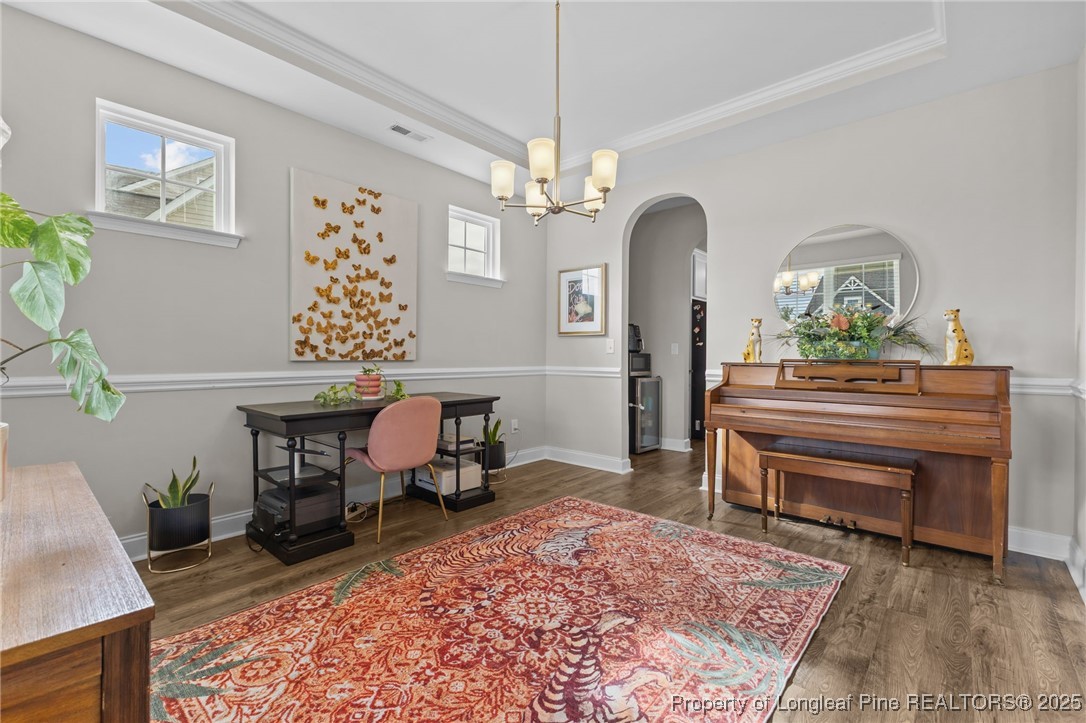 172 Haynes Church Road Raeford, NC 28376 - Photo 5 of 39 a living room with furniture a chandelier and a rug