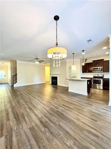 a view of a kitchen with microwave and cabinets