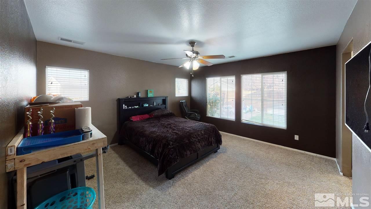 8900 Griffon Court Reno, NV 89506 - Photo 9 of 29 a bedroom with a bed and window