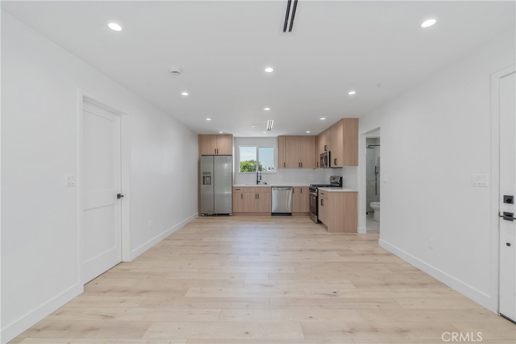 7435 Ranchito Avenue Van Nuys, CA 91405 - Photo 2 of 16 a view of a kitchen with a sink and cabinets